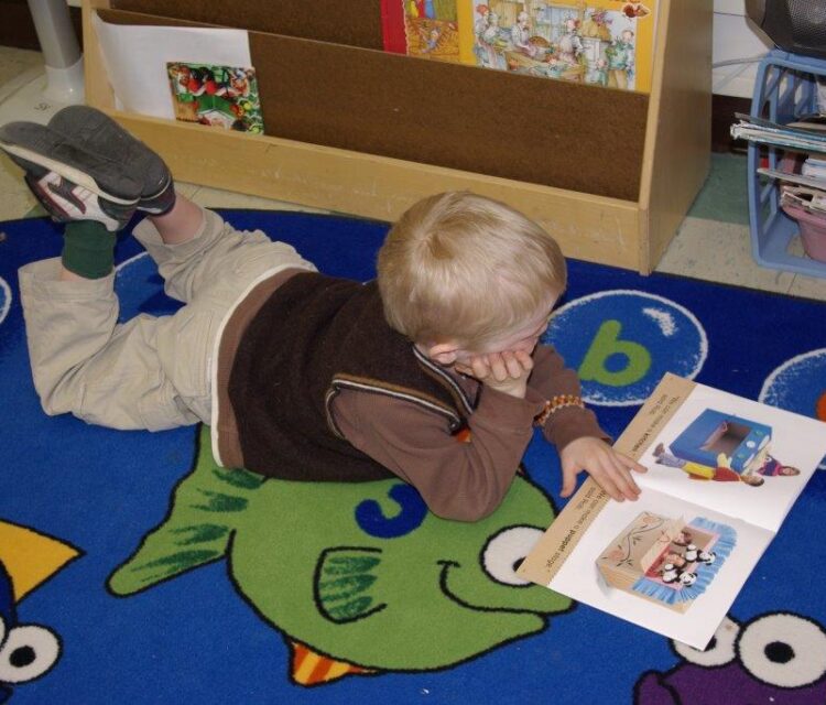 young boy reading