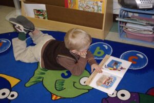 young boy reading