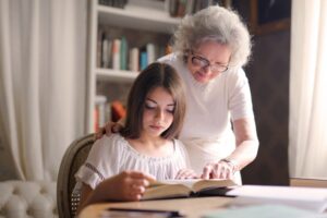 adult reading with girl